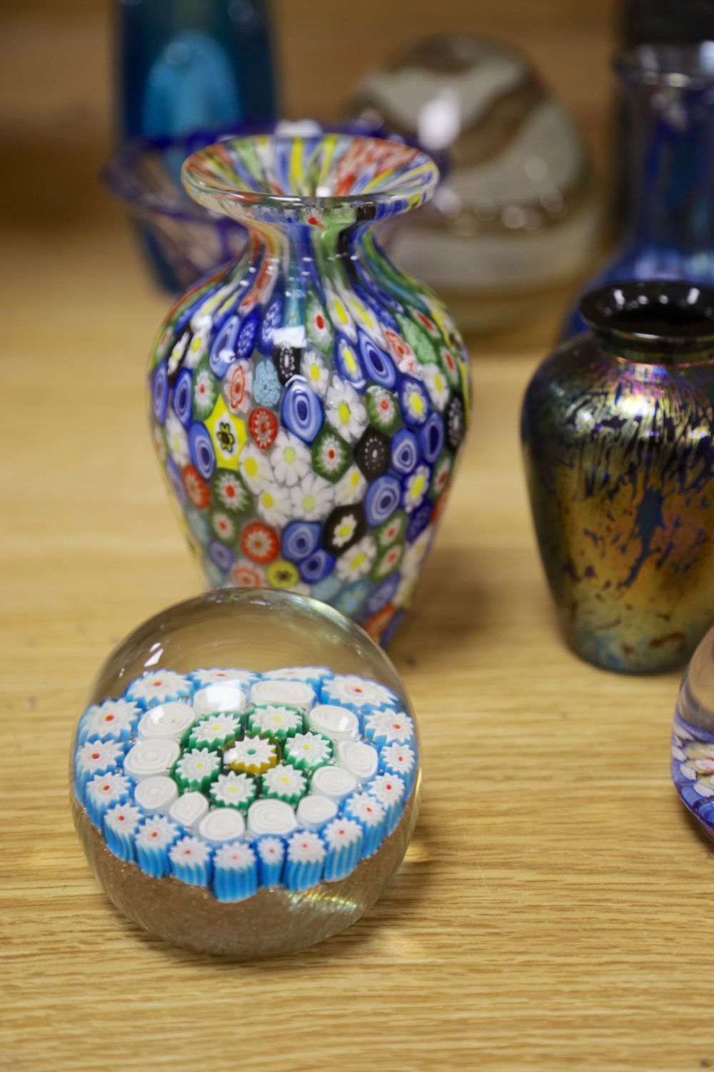 A millefiori weight, a scent bottle with stopper, a jar and six other coloured glass items